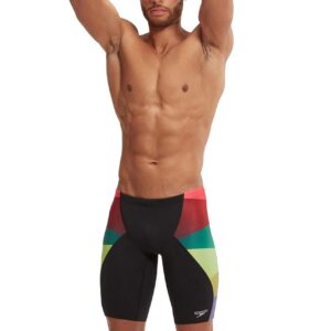 Front view of man standing wearing Speedo Placement Digital V-Cut Jammer - Green / Red