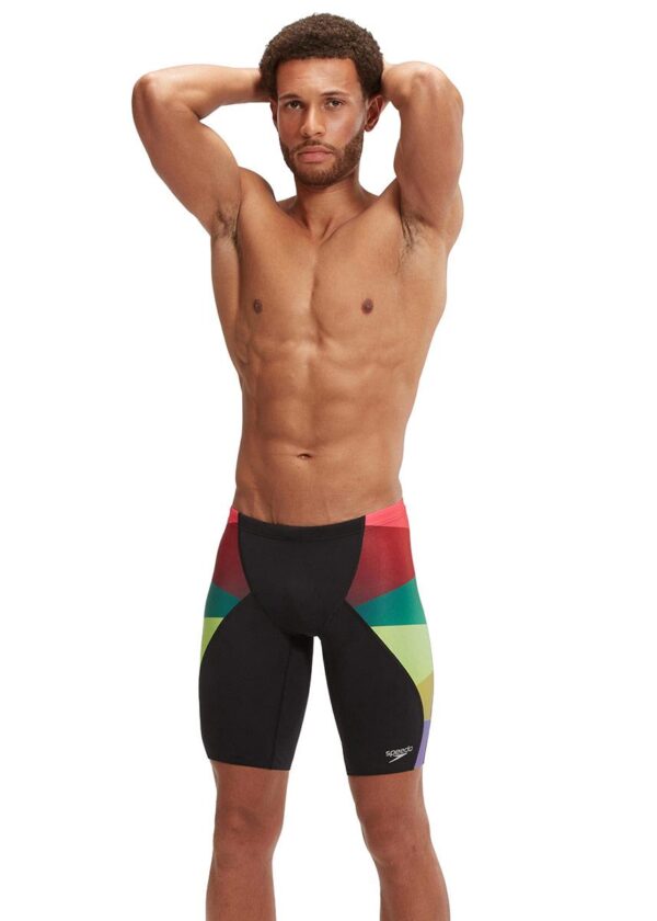 Front view of man standing wearing Speedo Placement Digital V-Cut Jammer - Green / Red