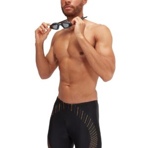 Man holding goggles wearing Speedo Duo Logo Print Mid Jammer - Black / Orange