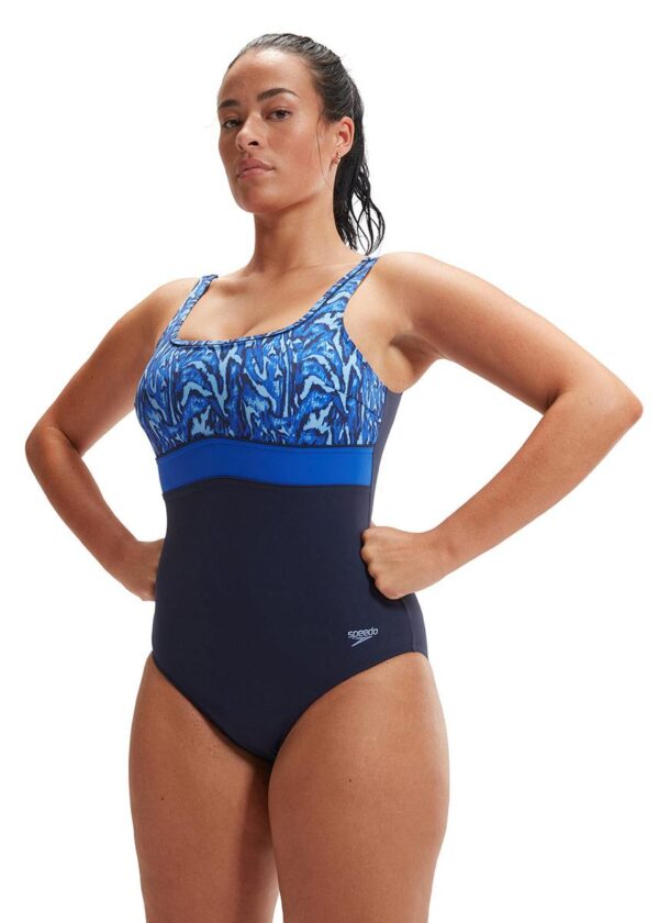 Lady with hands on hips wearing Speedo Shaping Contour Eclipse Swimsuit - Navy Blue / Blue