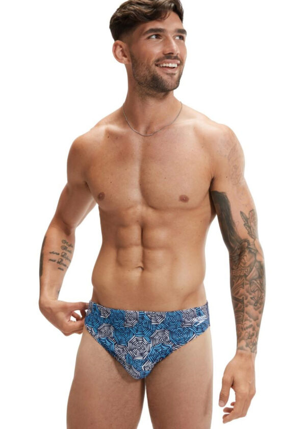 Man smiling looking towards his left wearing Speedo 5 cm Escape Brief - Blue / White