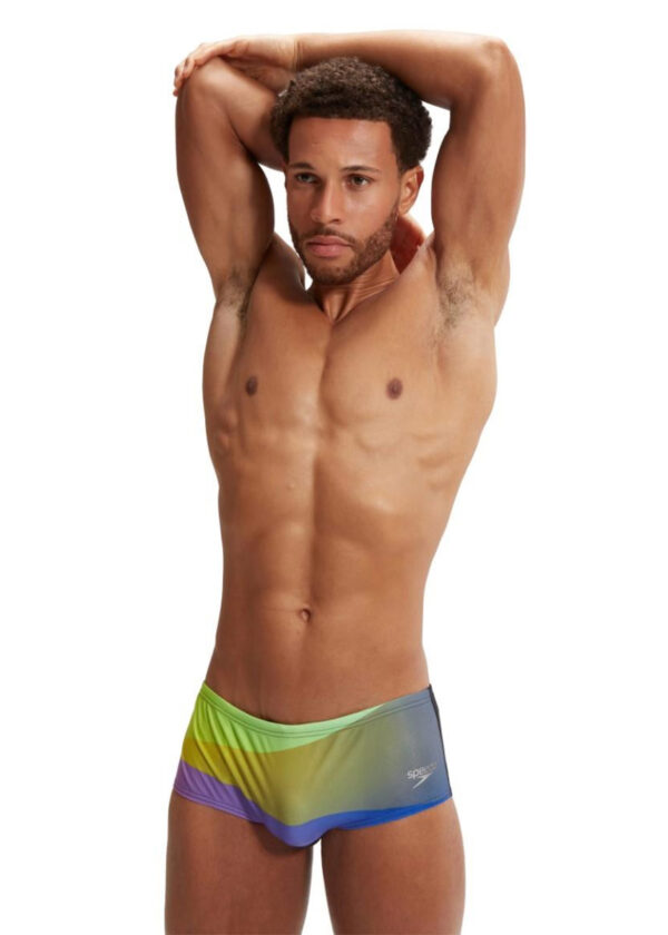 Man wearing Speedo Allover Digi 14 cm Brief - Black / Purple with hands folded over the head