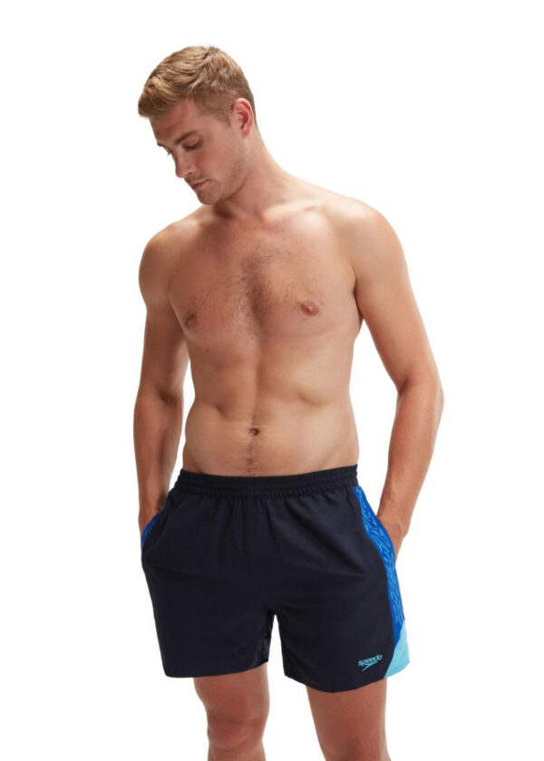 Man looking down wearing Speedo HyperBoom Splice 16" Watershort - True Navy / Tru Cobalt / Picton Blue
