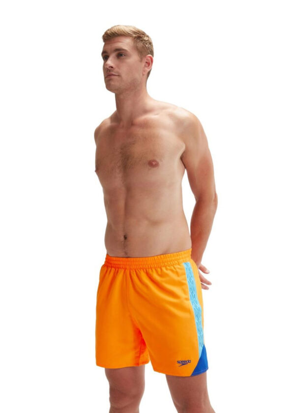 Man hoiding his hands behind back wearing Speedo HyperBoom Splice 16" Watershort - Mandarin / Blue / Cobalt